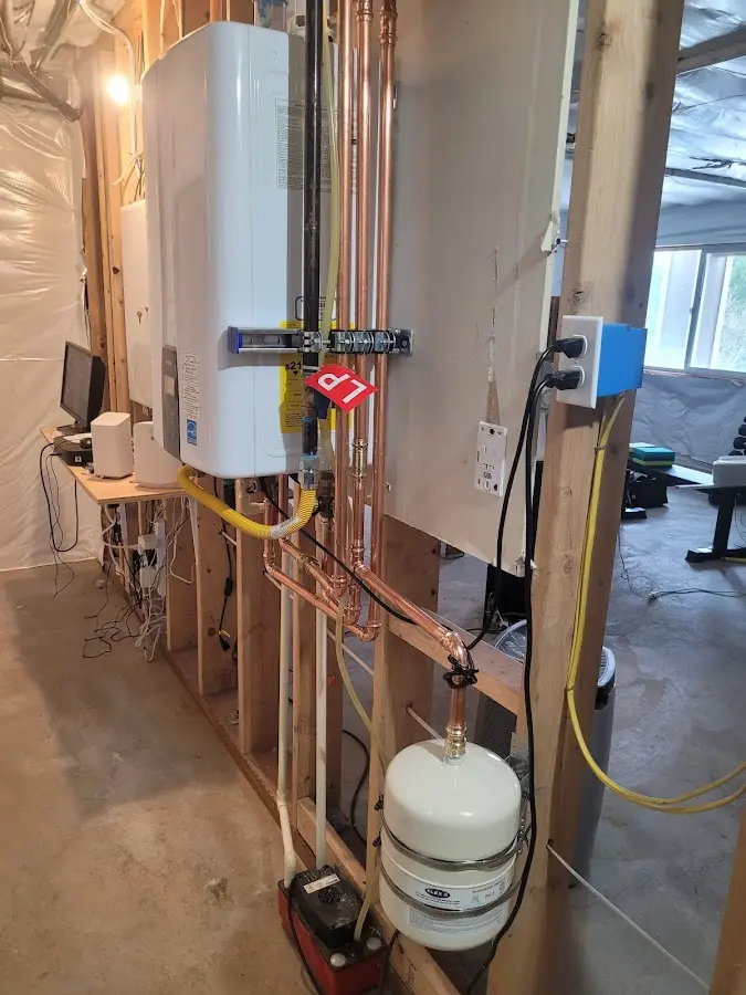 Licensed plumber repairing a kitchen sink in Anniston